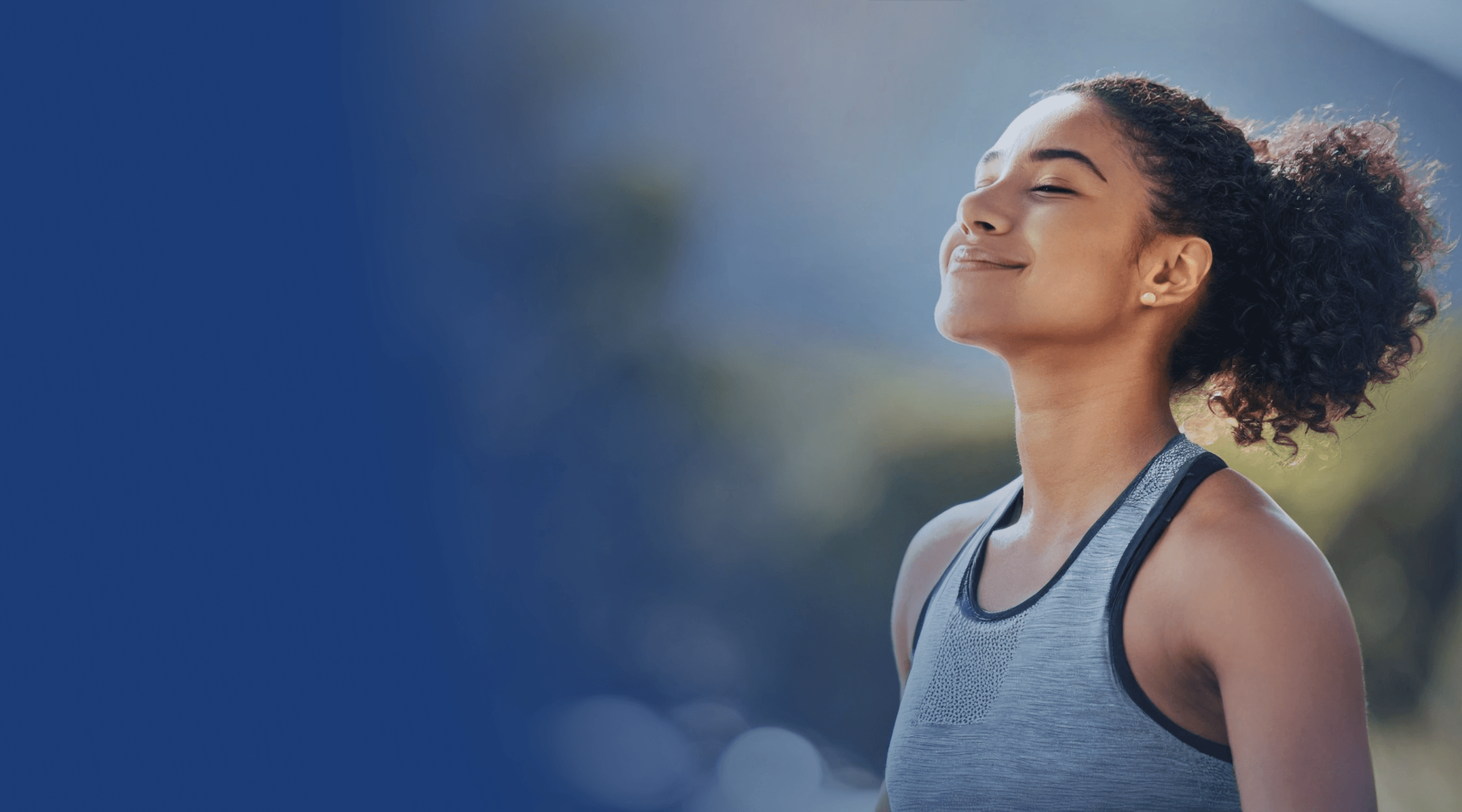 Professional nurse providing mobility assistance to an elderly patient in a bright healthcare setting.