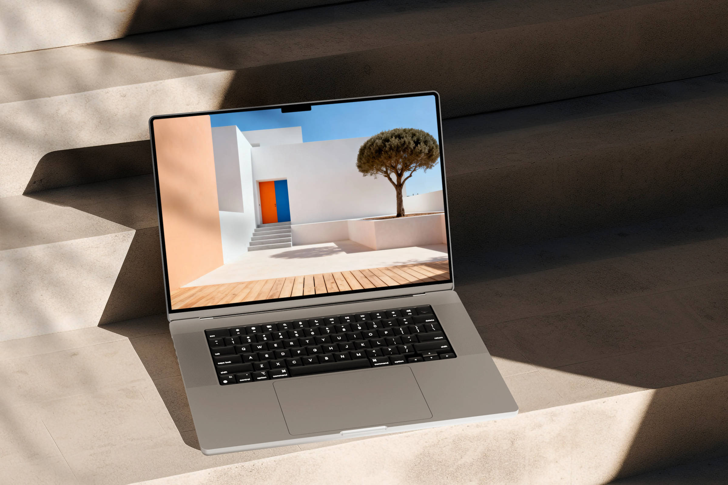 Laptop showcasing abstract architecture on sunlit stairs