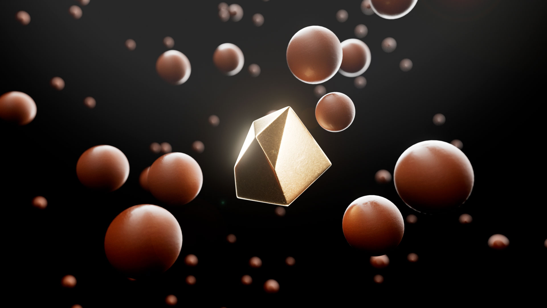 Toblerone Gold Truffle in a black space with other spherical chocolates