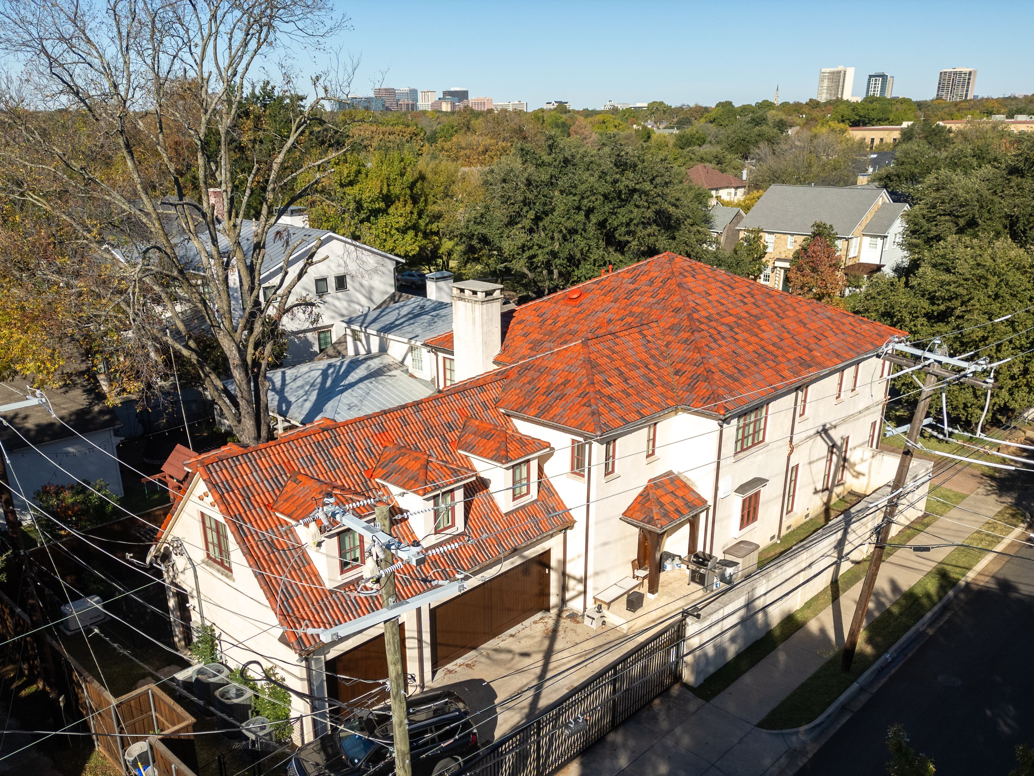 Mediterranean revival home in Highland Park with clay tile roof replacement