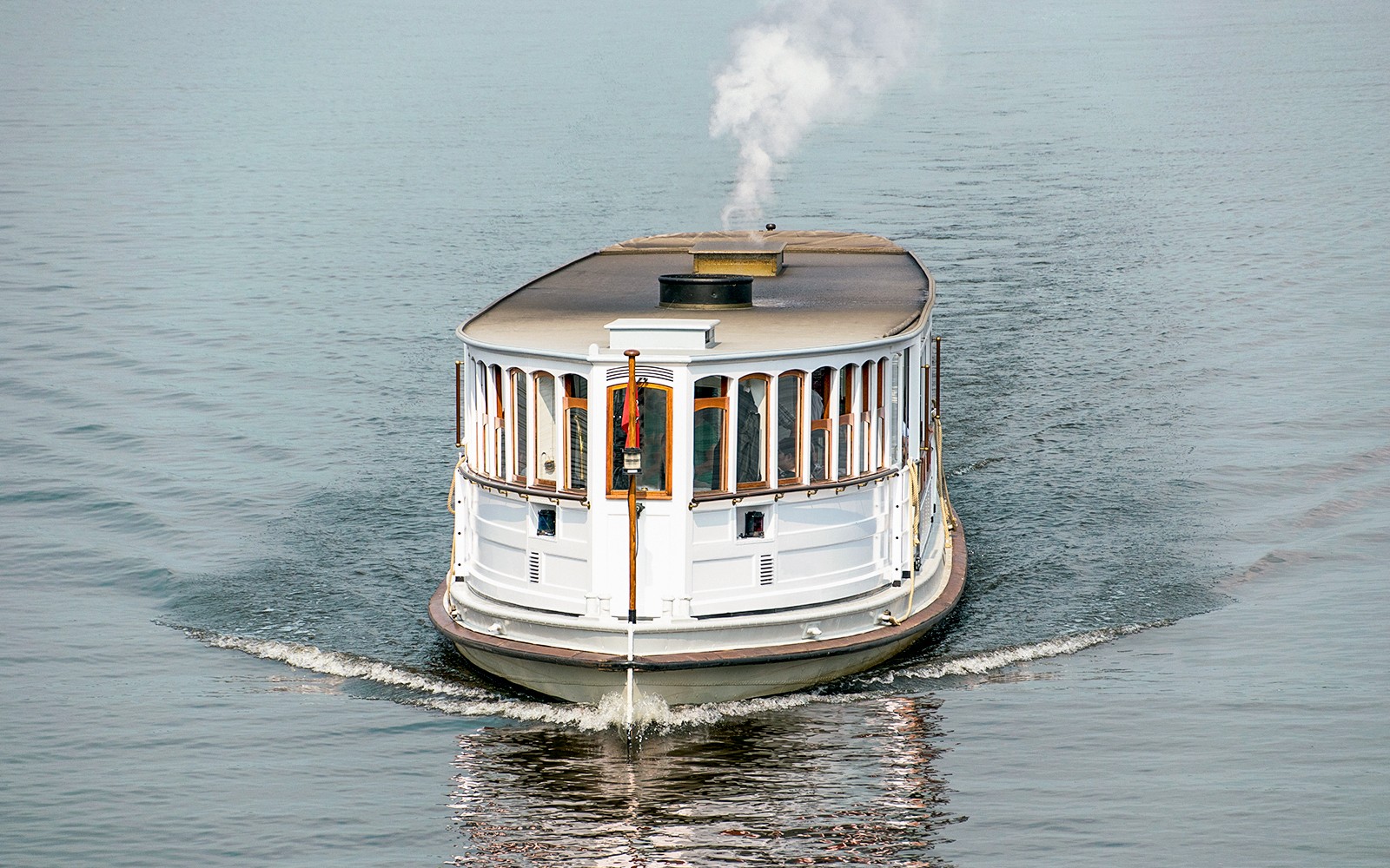 Historic steamboat cruising on Hamburg's waterways.
