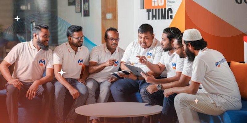 A corporate team reviewing training material together