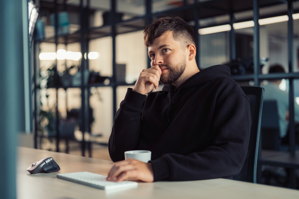 Close-up of a human eye illuminated by red light, symbolizing AI vision and digital innovation.