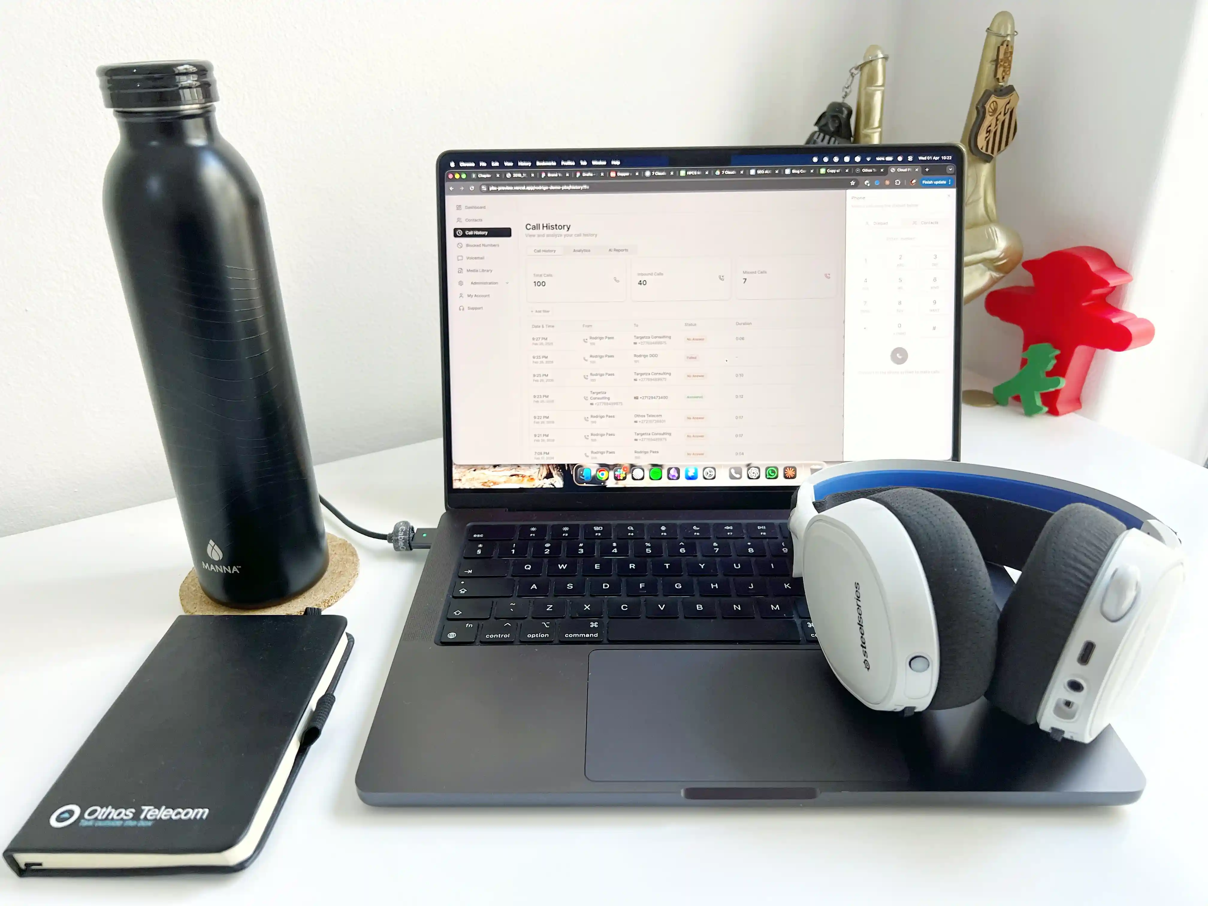 Remote work setup using Othos Cloud PBX — laptop showing call history dashboard with headset