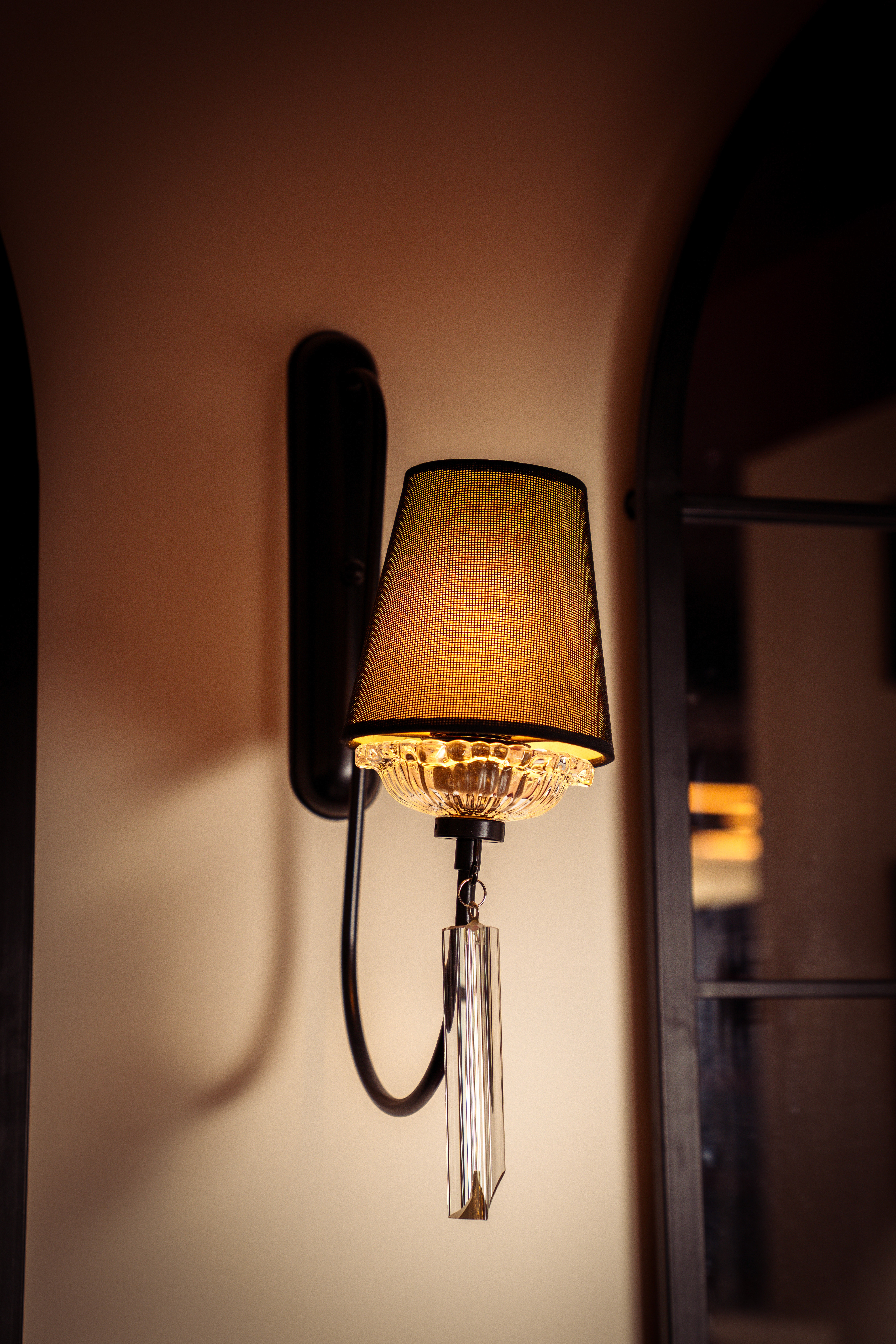 Traditional carpeted stairs ascending with candle-like wall stands and classic interior styling.