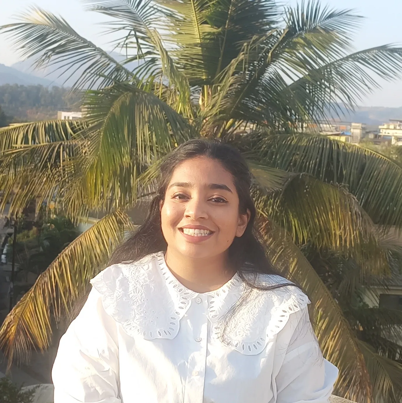 woman in white crew neck shirt smiling