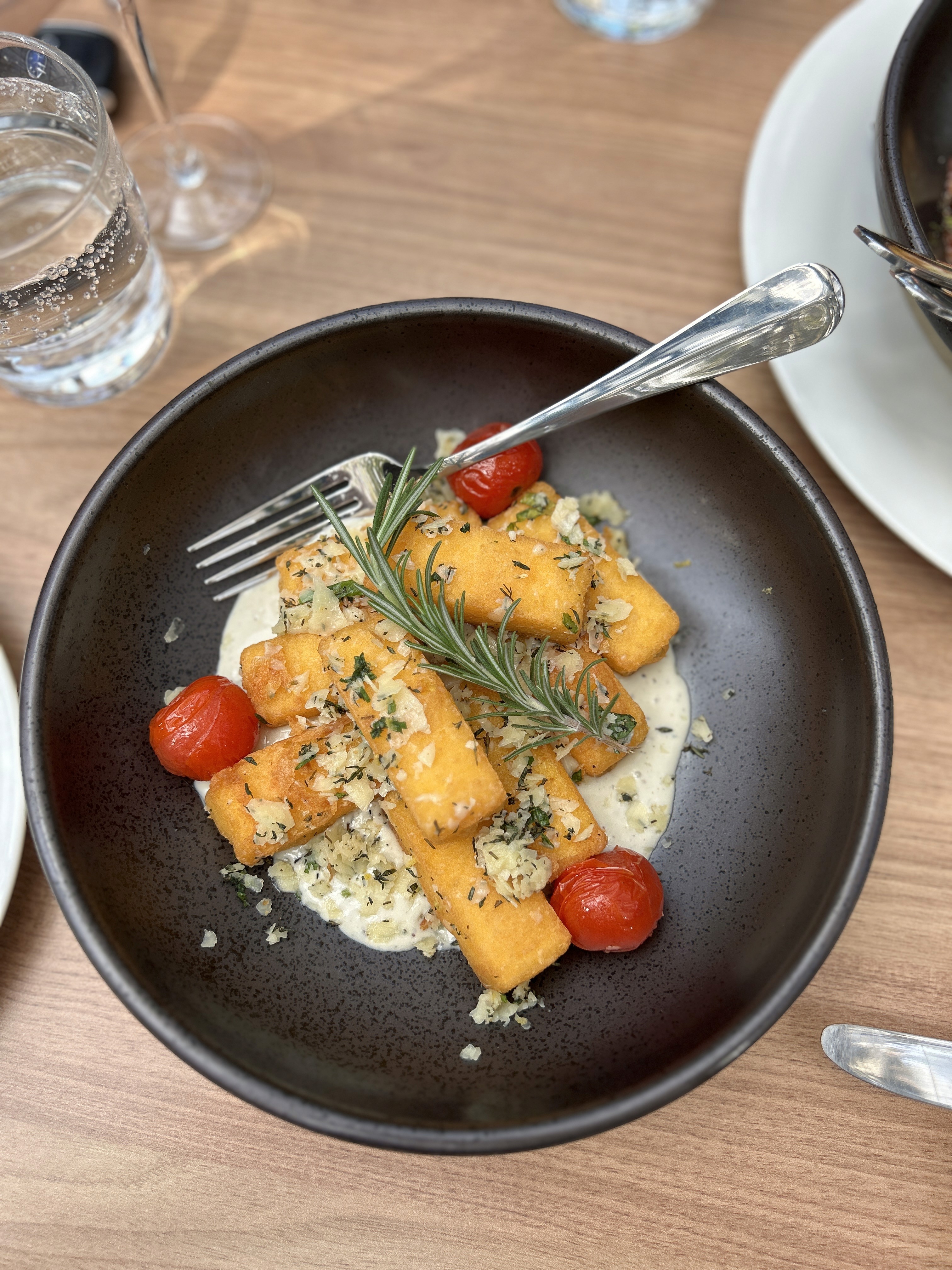 Seared scallops in a white plate