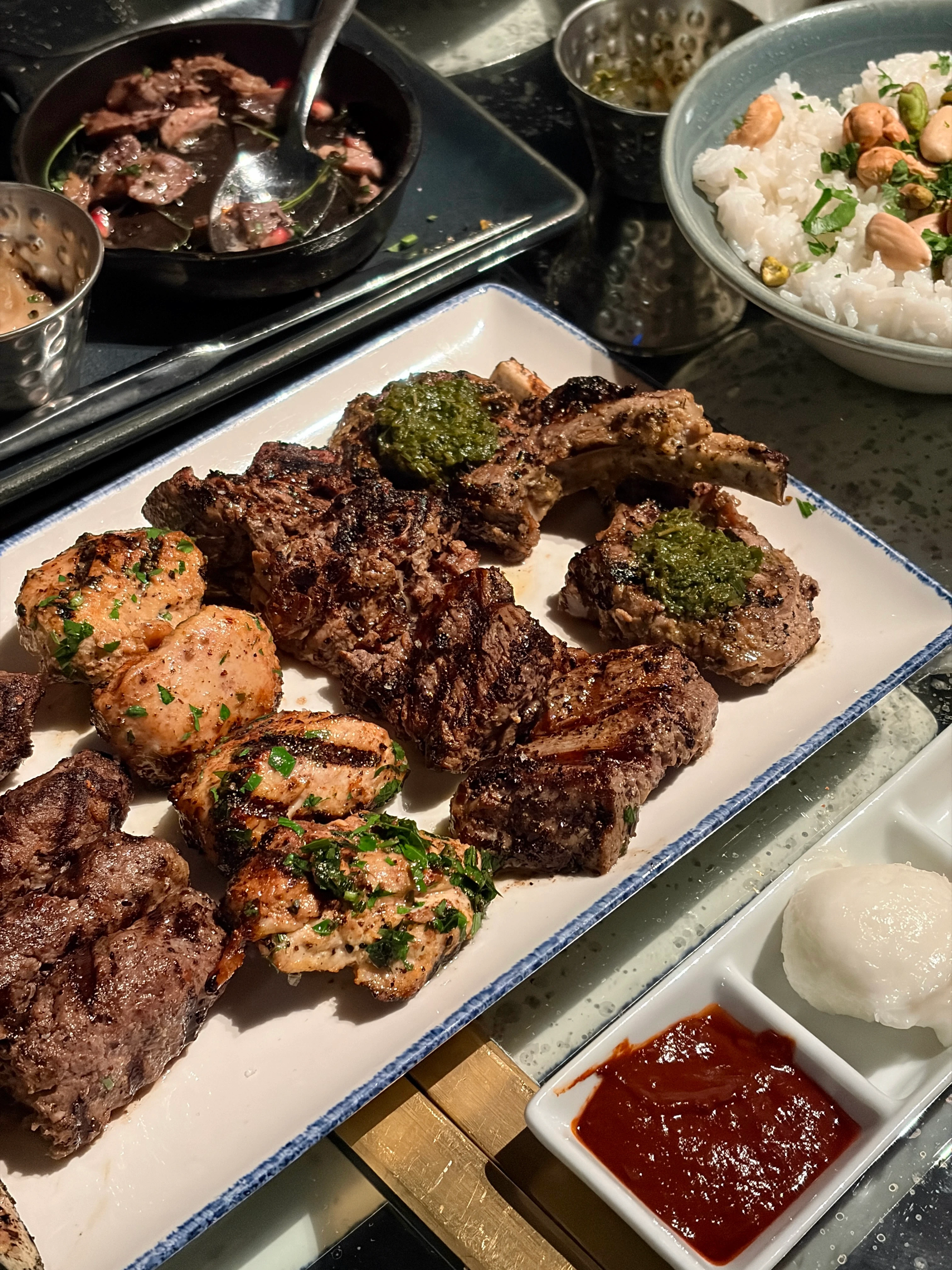 iliili DC dinner with the mezze platter of chicken, lamb, and beef with the duck on the side and a bowl of lebanese rice 