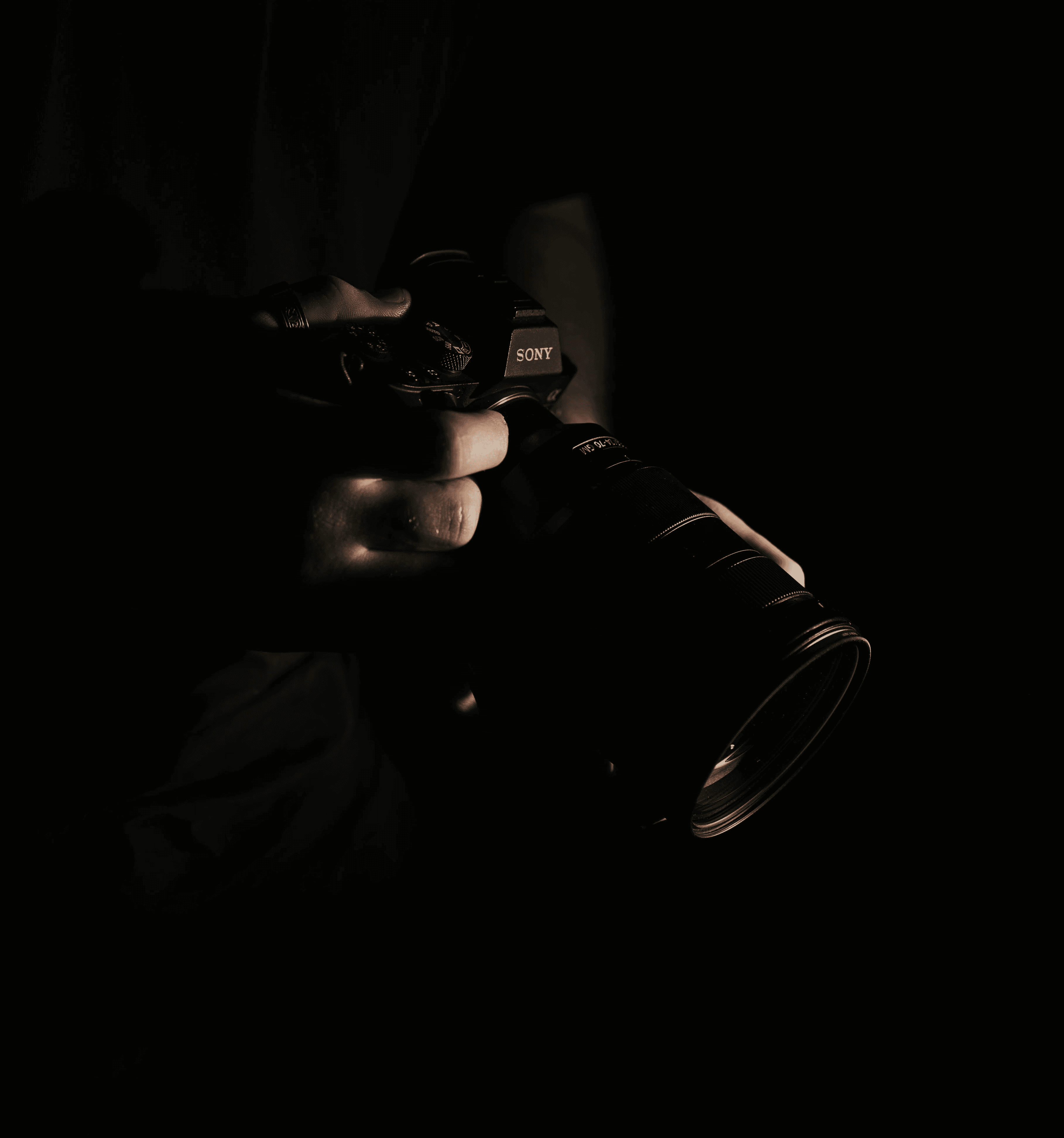 person holding black DSLR camera