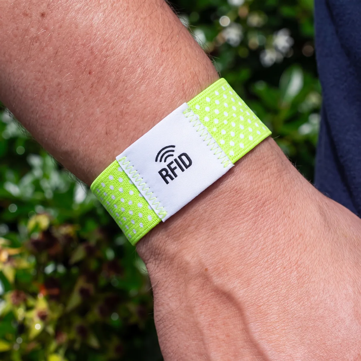 RFID stretch wristband with woven label at an outdoor event