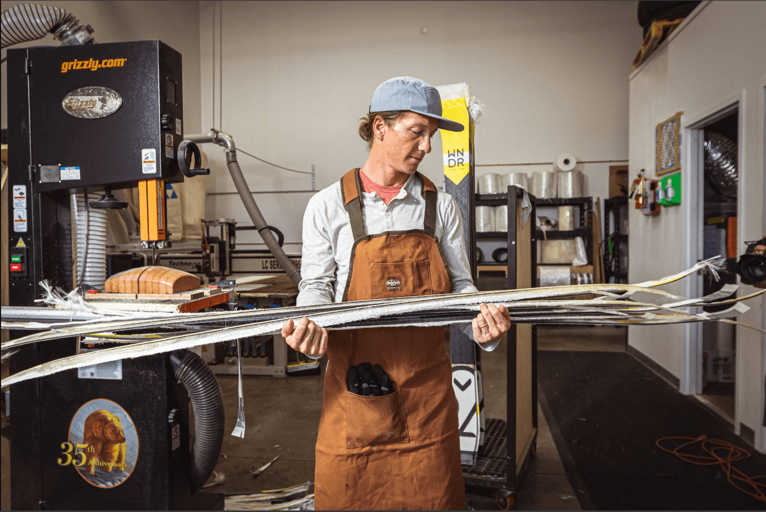 Image: WNDR, a staff emeber with offcuts of skis