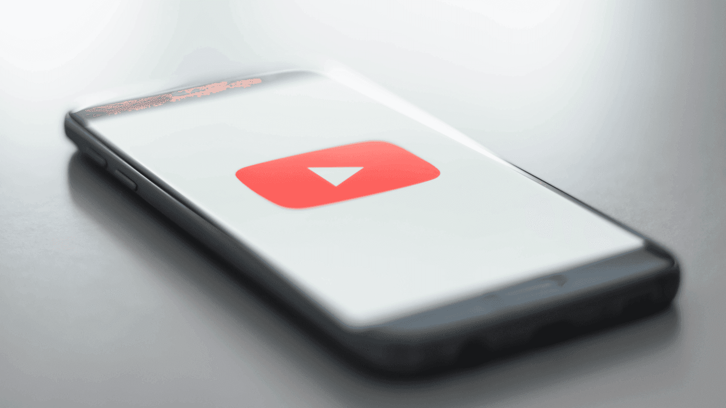martphone displaying the YouTube logo - How To Summarize YouTube Videos
