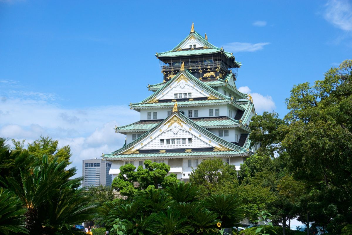 three brown wooden boat on blue lake water taken at daytime
