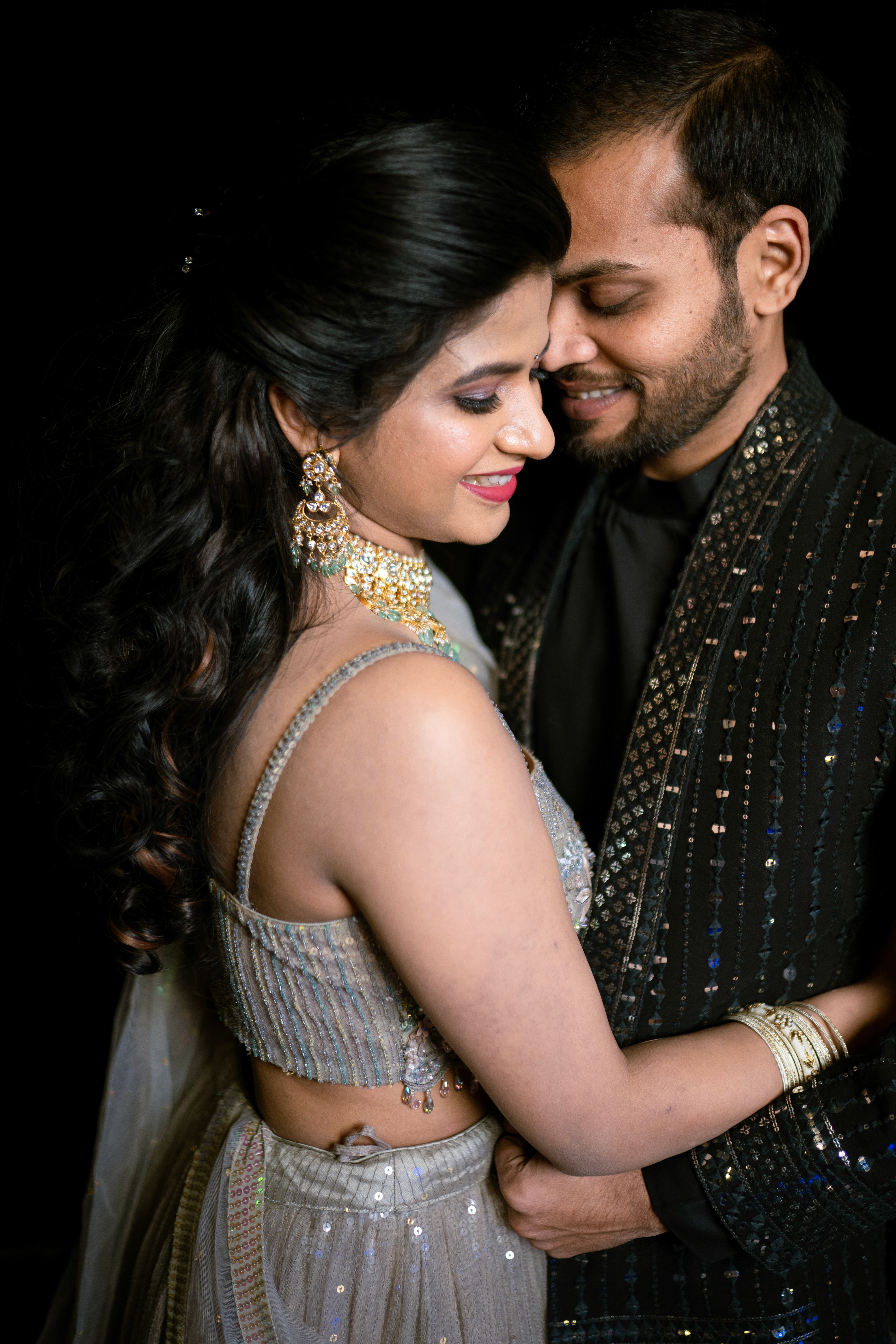 Mounika and Satya share a romantic embrace. Captured by Out of The Blues Fine Art Wedding Photography in Hyderabad.