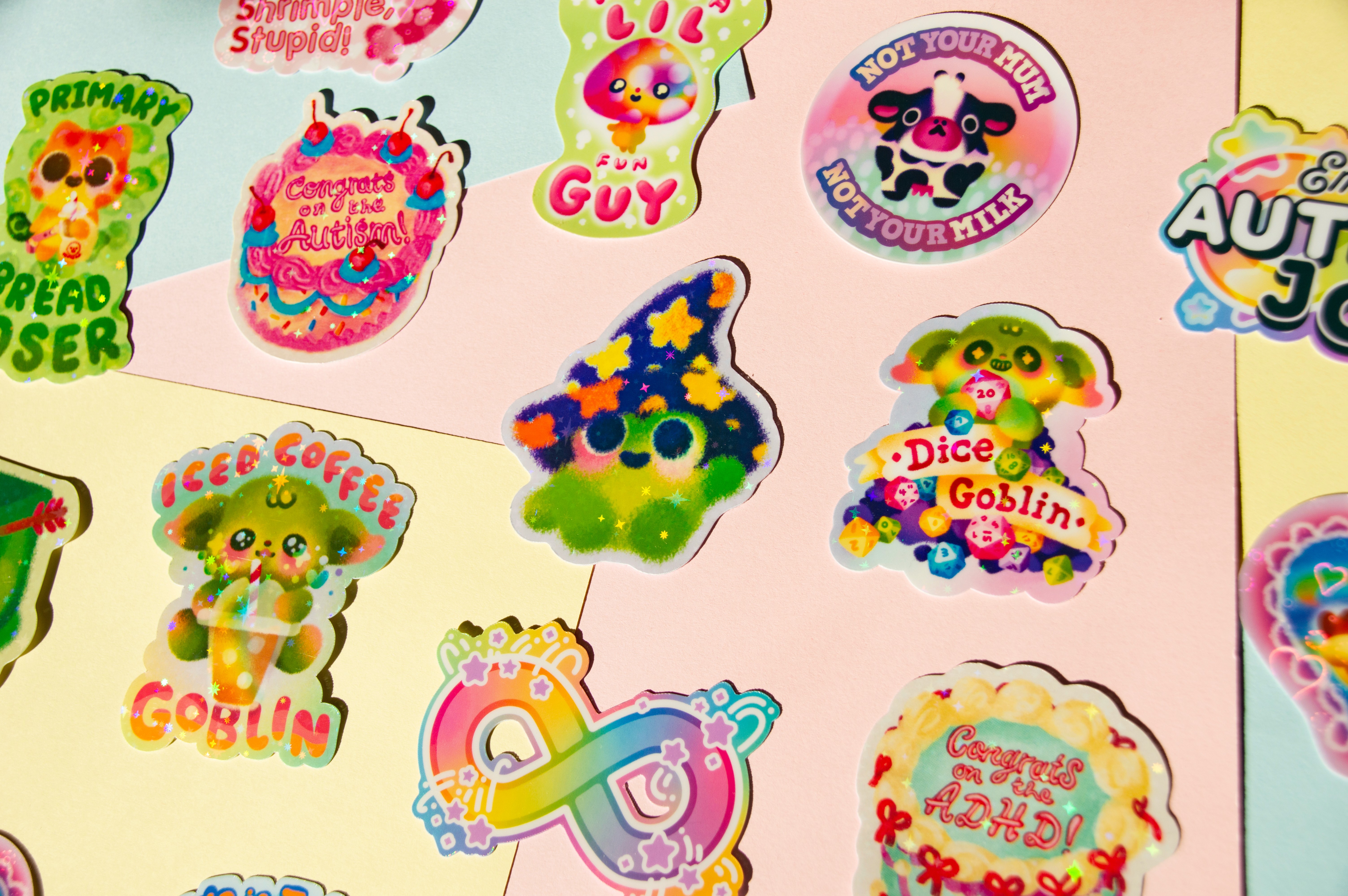 Various brightly coloured stickers on a multicoloured background.
