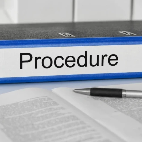 Medical procedure document binder and pen on a desk at a specialist clinic serving Coburg and Melbourne's northern suburbs.
