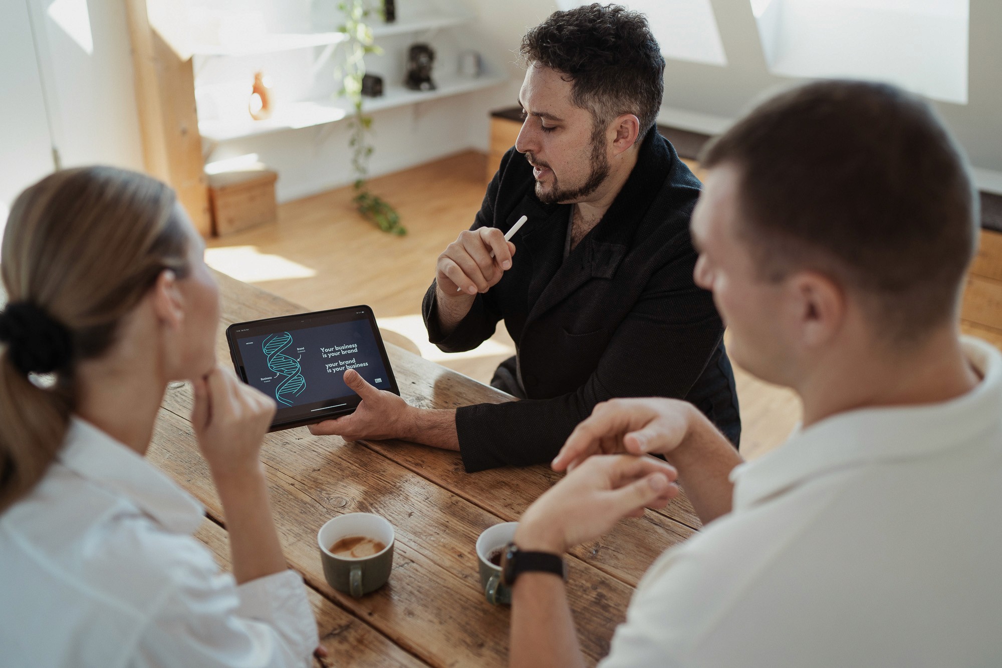 Founder reviewing brand strategy material in a StoryOS clarity sessio