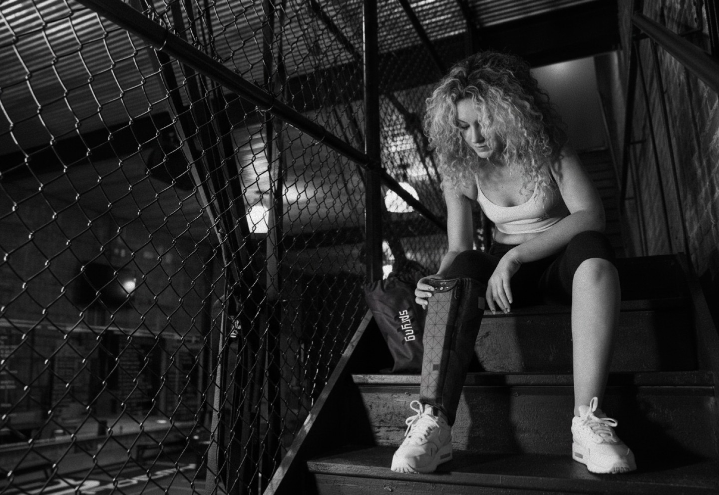 Black and white image of a women using a recovery boot