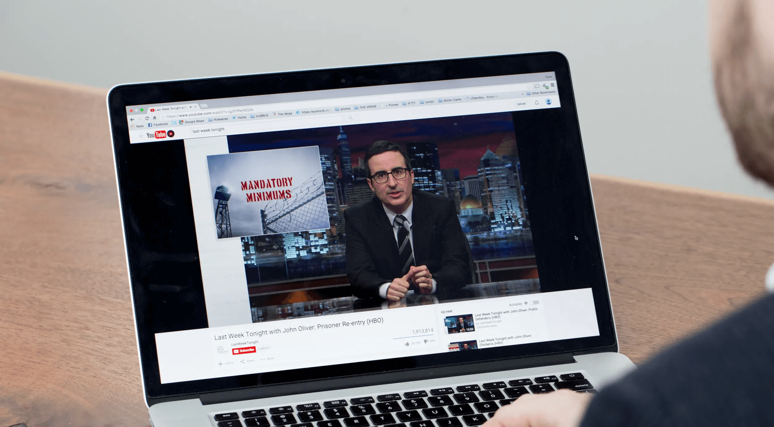 Person watching youtube on laptop - YouTube Average View Duration