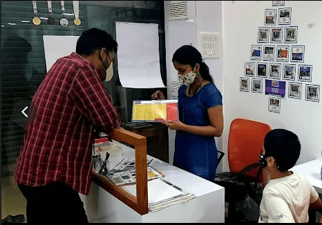 Young girl with backpack walks on dirt path