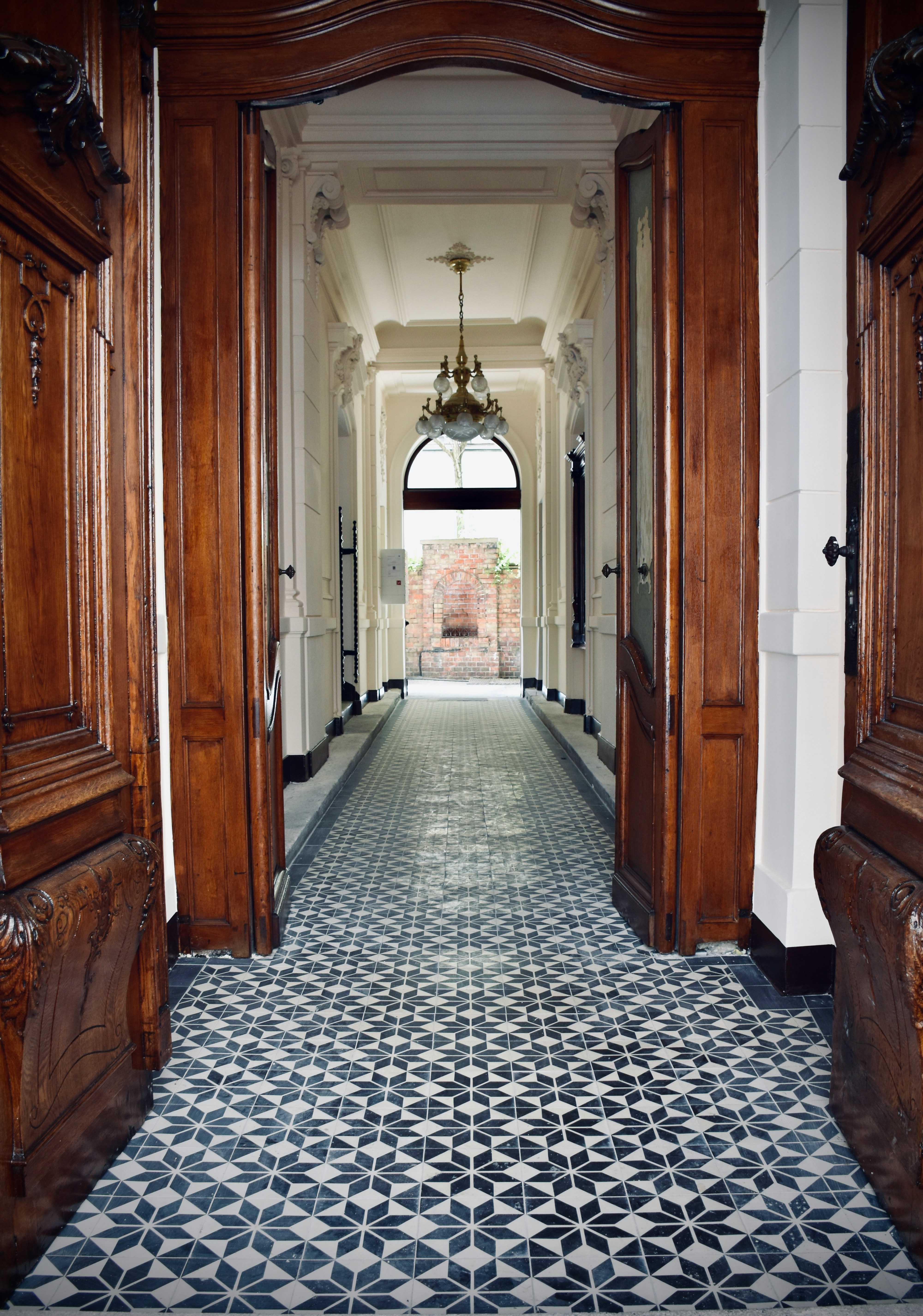 brown wooden door on hallway