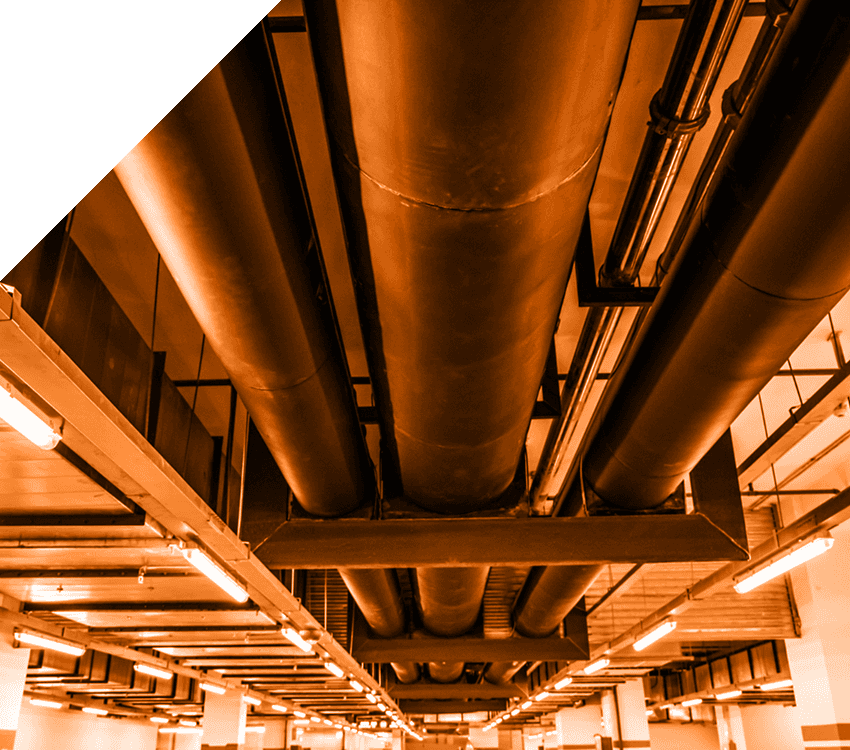 An image of ducting pipes running along the roof