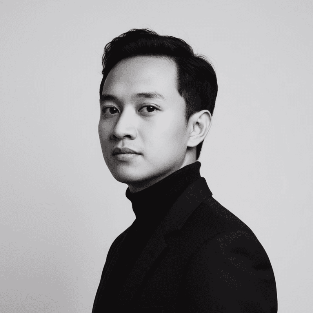 Black and white portrait of a man with a beard and glasses