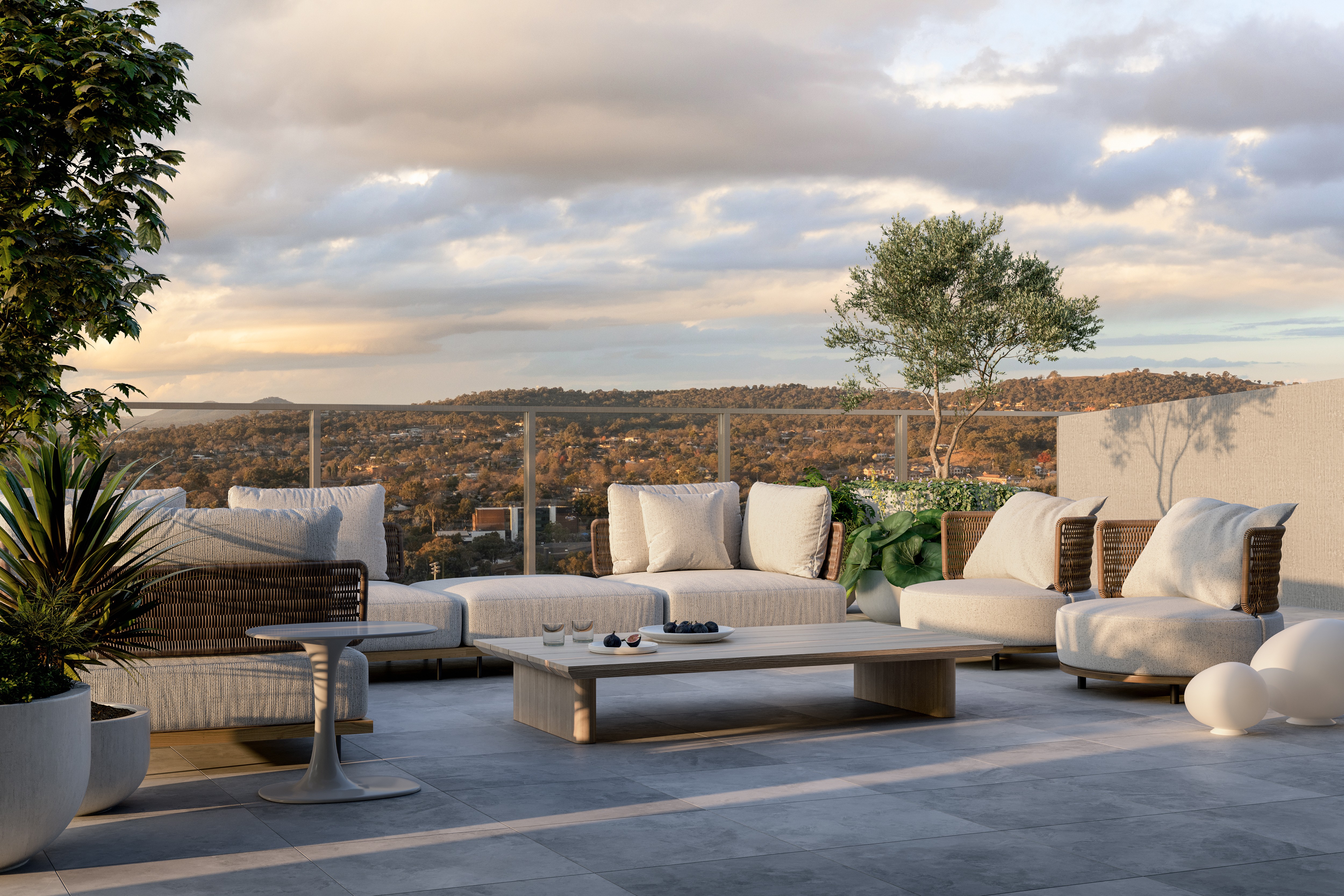 Rooftop terrace at The Charlotte Woden with outdoor lounge seating, lush greenery and panoramic Canberra views, available in Coposit off the plan homes.