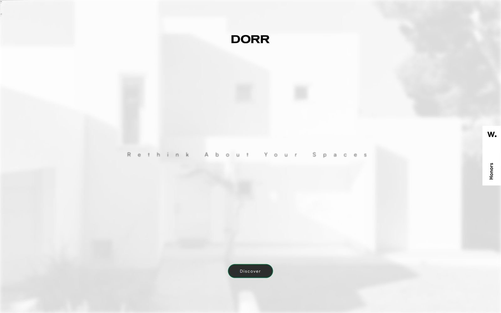 Blurred white building with black text "DORR" centered. Slogan reads "Rethink About Your Spaces." Green button labeled "Discover.
