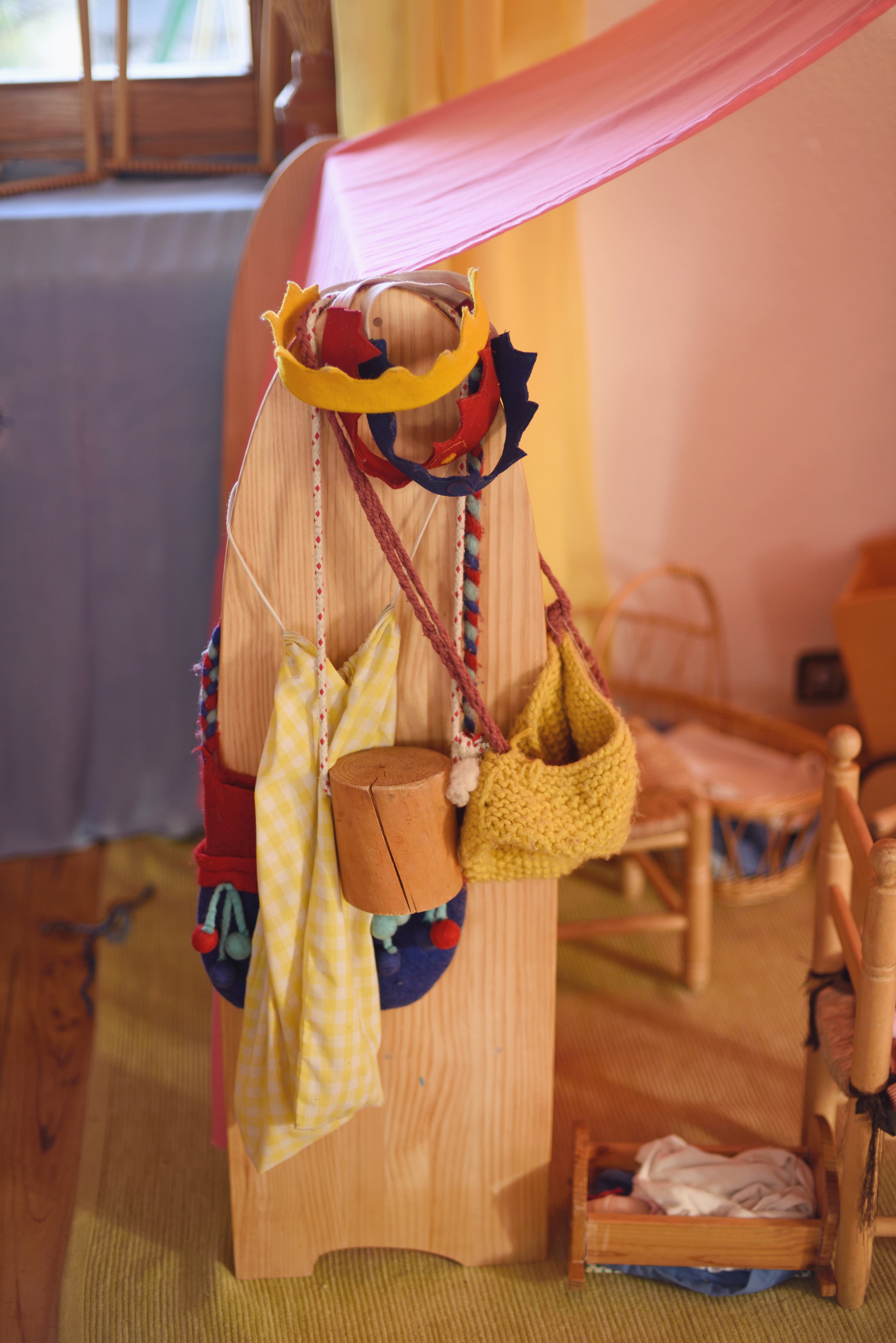 Close-up of lush, dark green leaves, some glossy and wet, against a muted background.