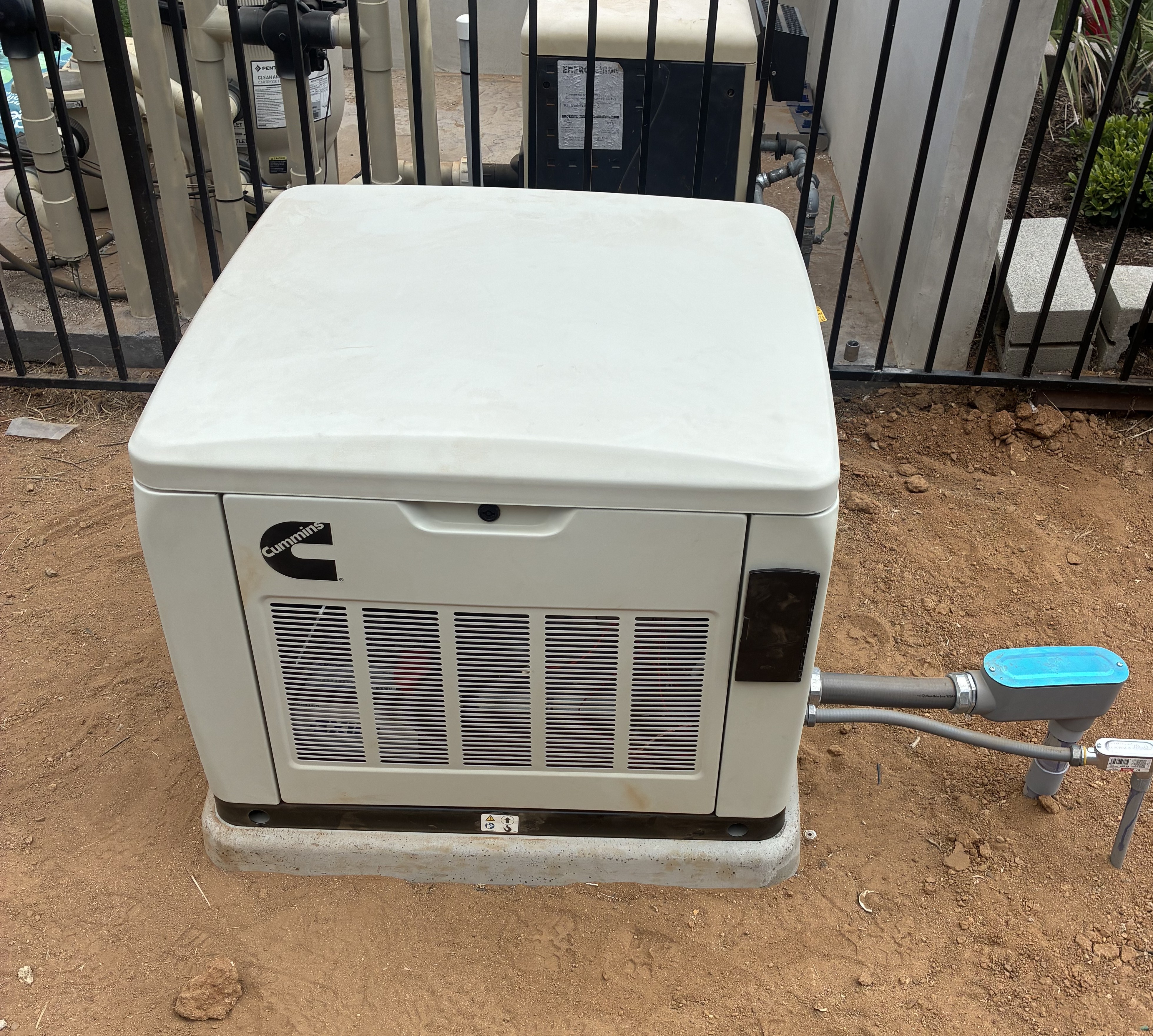 a electrical panel on a wooden wall with a yard in the background