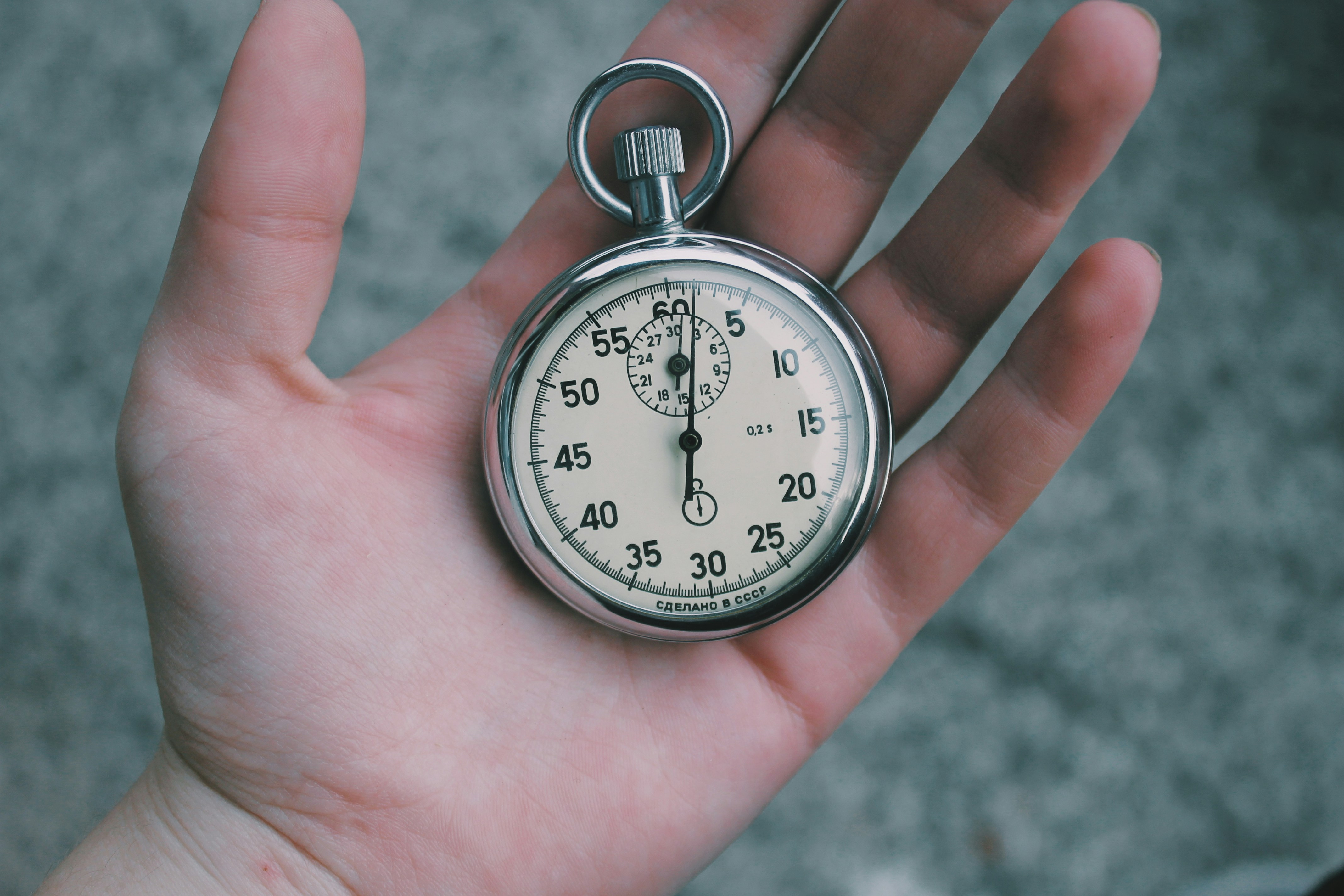 man holding clock - Tiktok Video Dimensions