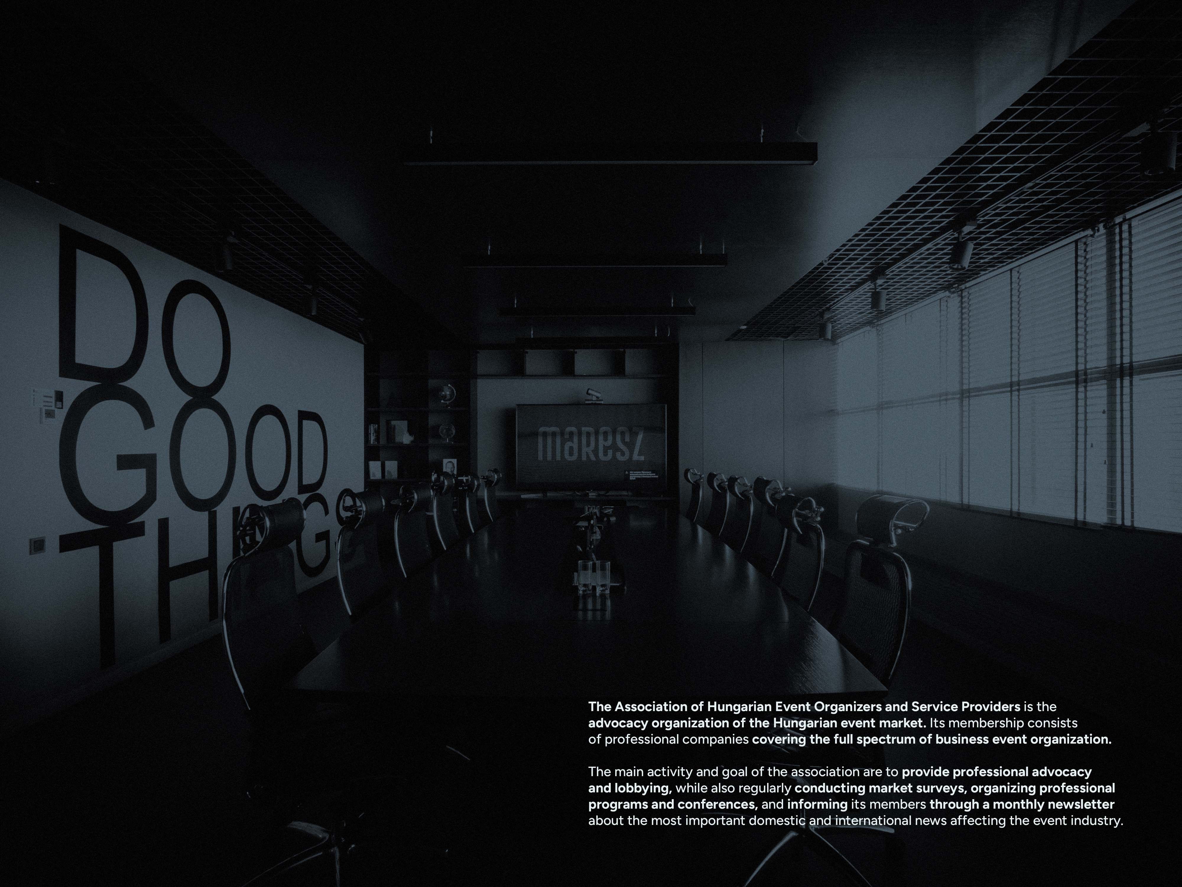 Conference room scene with logo screen and brand overview text - MaReSz, an event association brand identity.