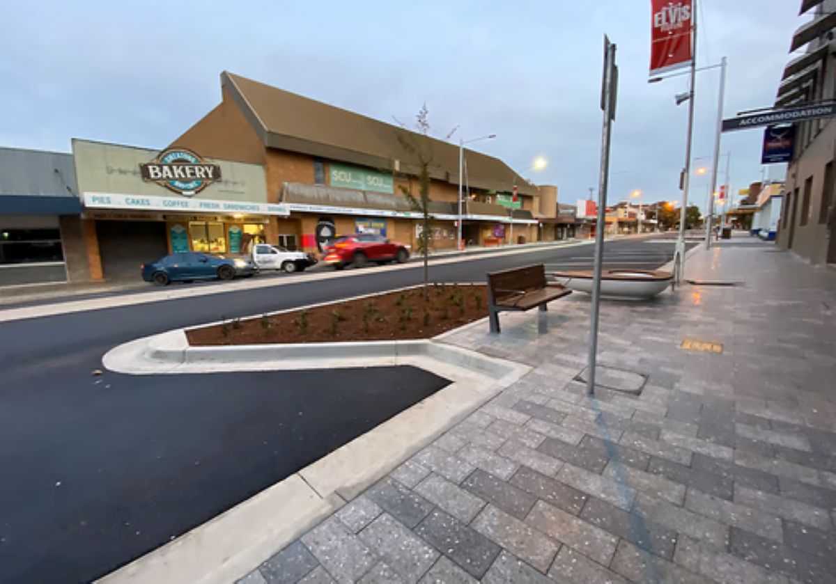 Finished main street renewal project by Uminex showing improved traffic flow, safer pedestrian access, upgraded road infrastructure, and revitalised retail frontage.