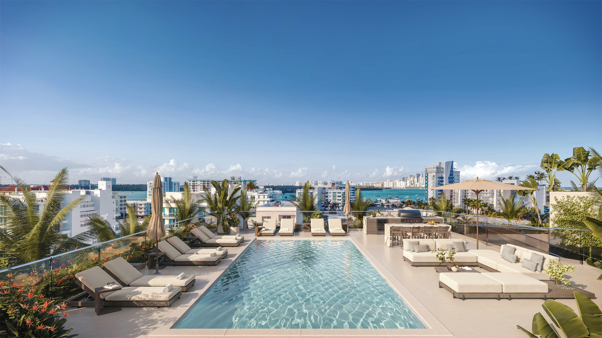 An elegant rooftop pool offering breathtaking views of the ocean and city, perfect for a tranquil escape.