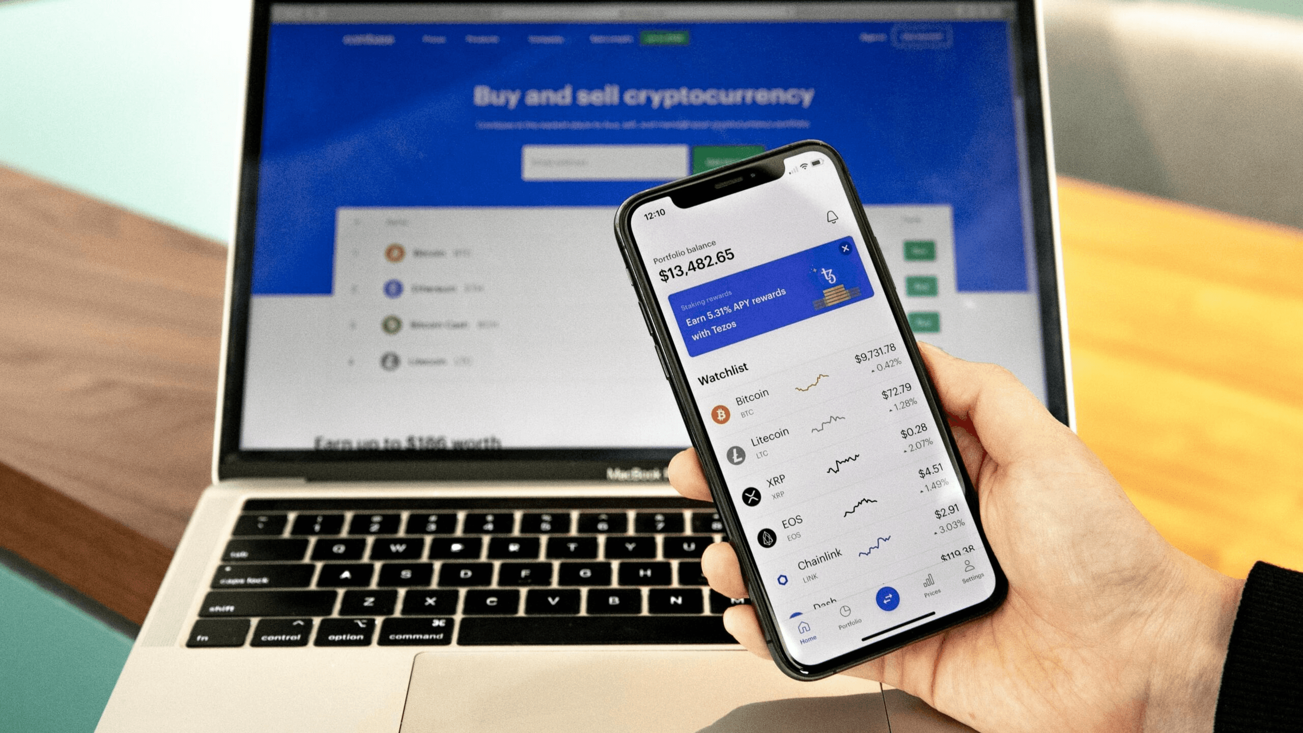 Smartphone and laptop displaying crypto exchange - How to Withdraw Money From an OnChain Wallet