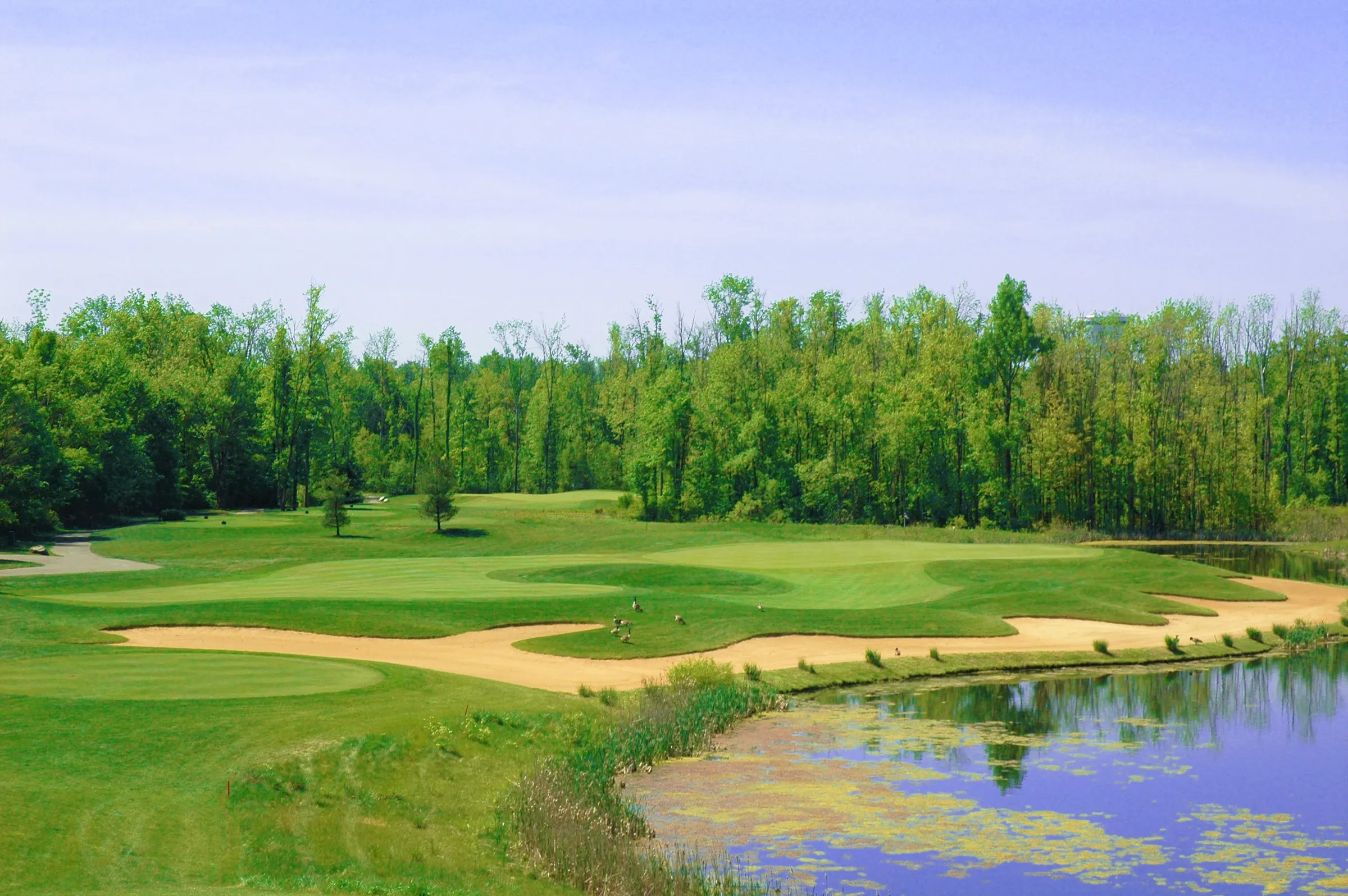 Fairway with sand bunkers and water at Cumberland Trail