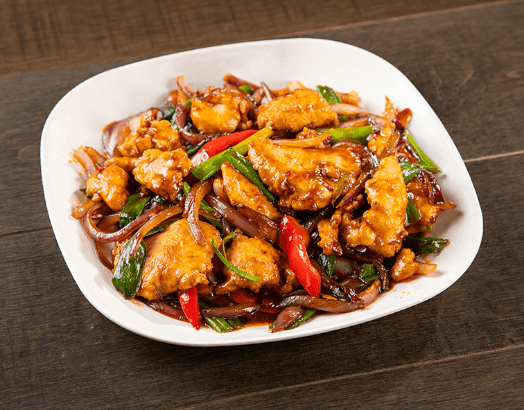 Orange Chicken with Fresh Citrus Twist – Golden, crispy orange chicken drizzled with a vibrant sauce made from fresh orange juice and zest, a signature dish at Everspring Modern Chinese in Tustin, California.