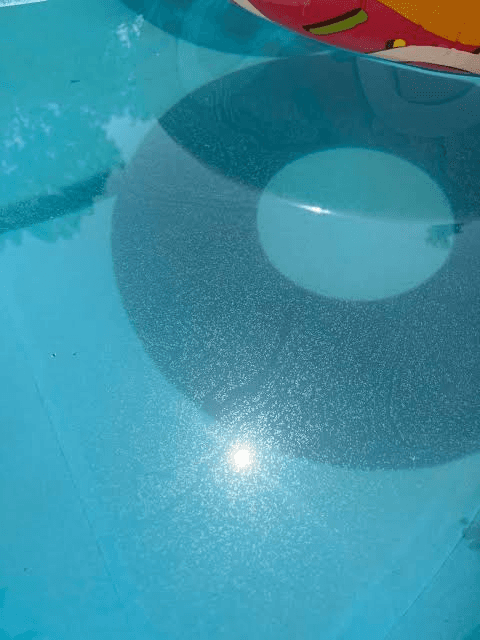 What Causes Scum on Top of a Pool?