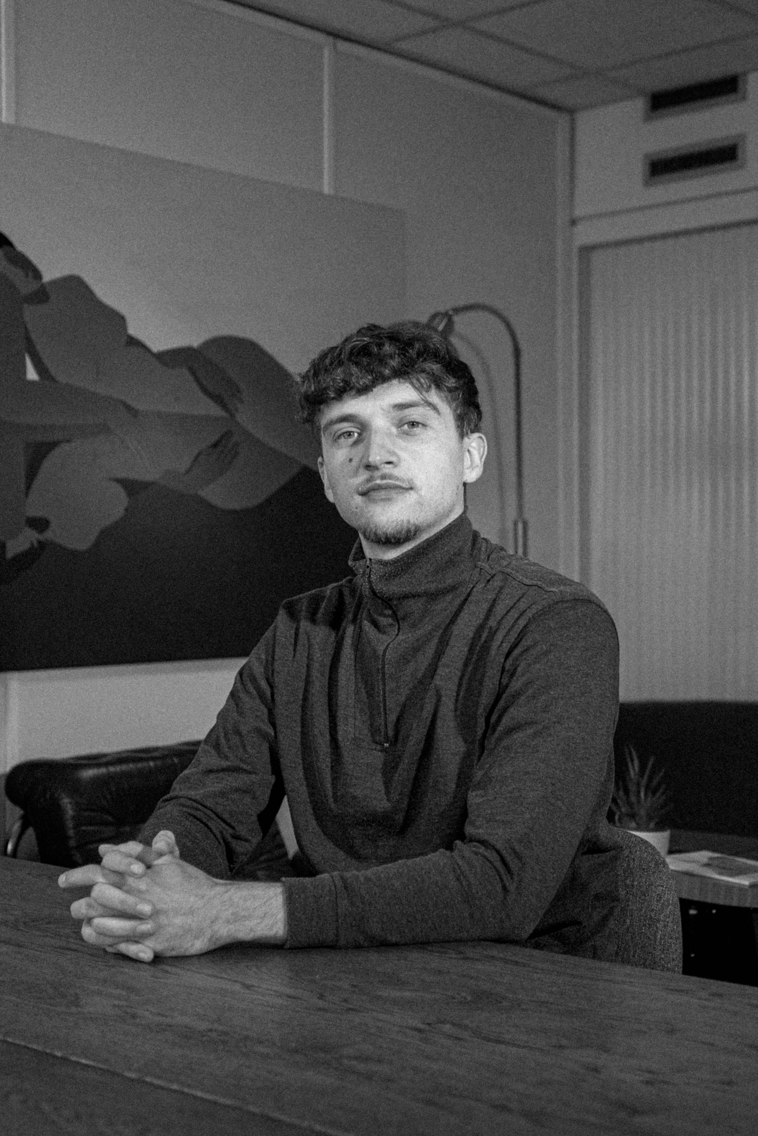 Kneeling man in studio