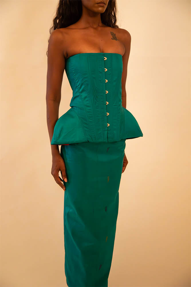Kamal is a one-of-a-kind bell corset and skirt, handcrafted by skilled artisans in-house using a vintage emerald green silk saree.