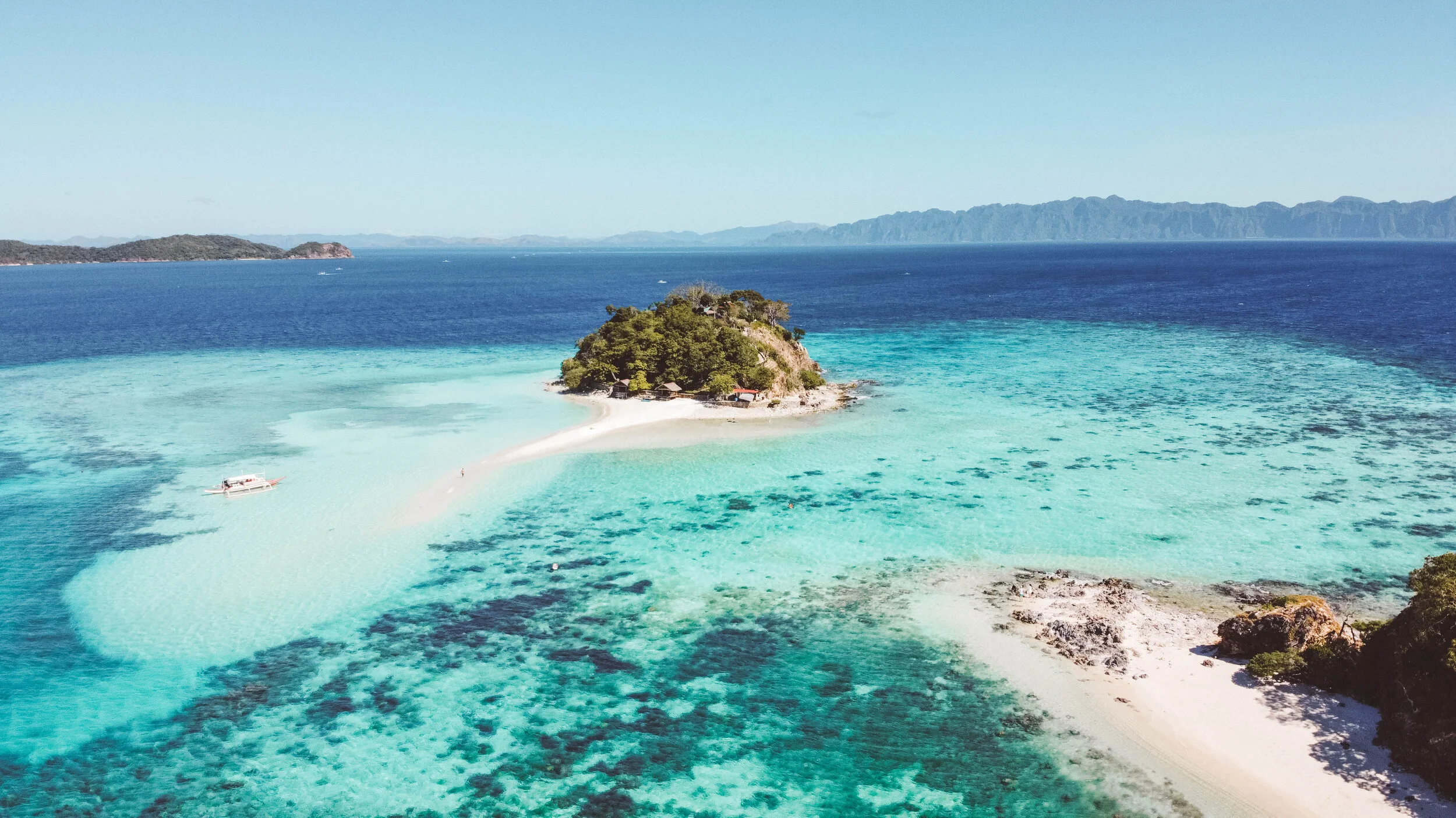 low-angle photography of two men playing beside two women