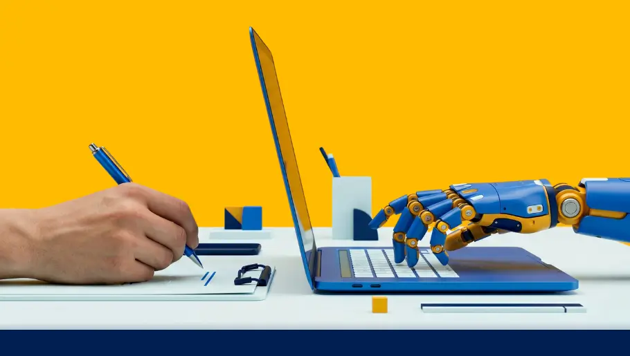 Human hand writing and robot hand typing on laptop, contrasting AI and human content creation.