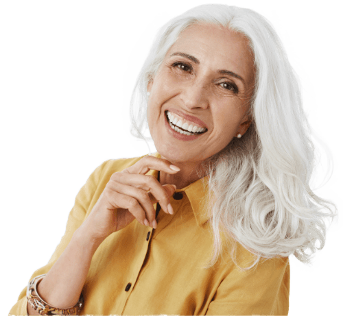 Older woman with white hair smiling warmly, on a transparent background, used for the cosmetic dentistry section
