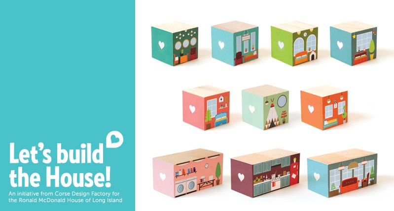 A poster with text: Let's build the House! Also there are some colorful cube shaped boxes with different household items on them.