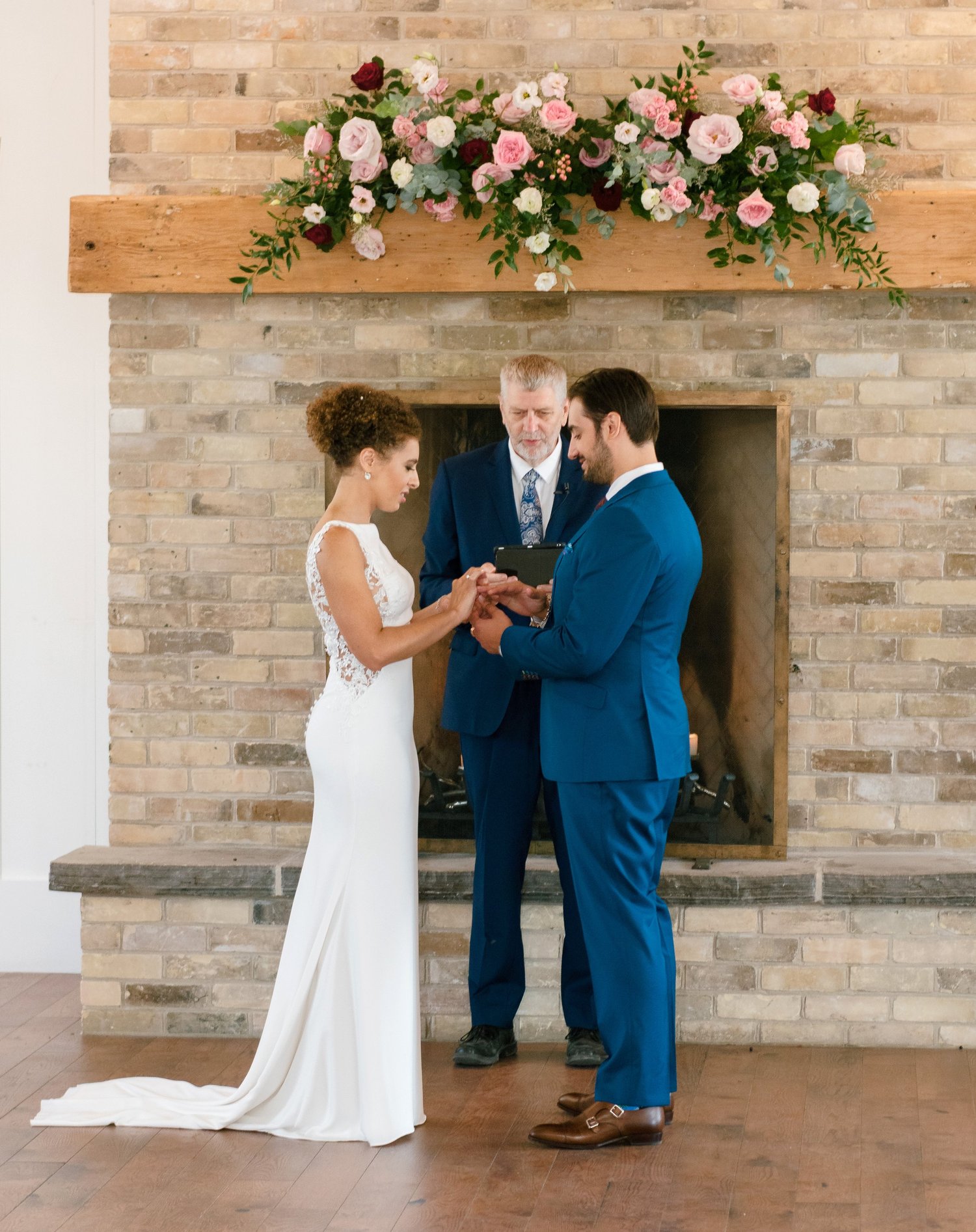 Bride and groom exchanging vows at Elora Mill
