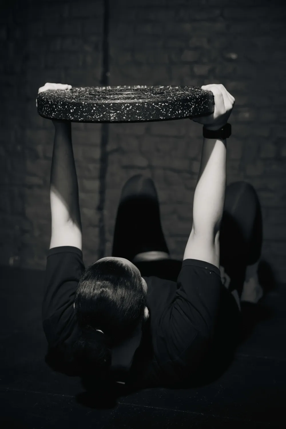 woman holding dumbell
