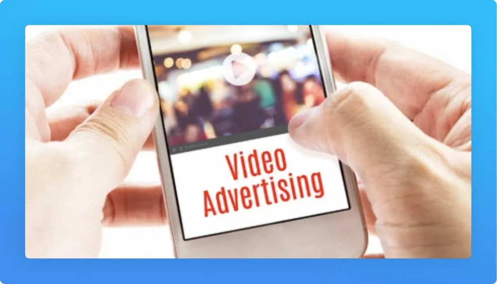 Hands holding mobile phone displaying a video advertising
