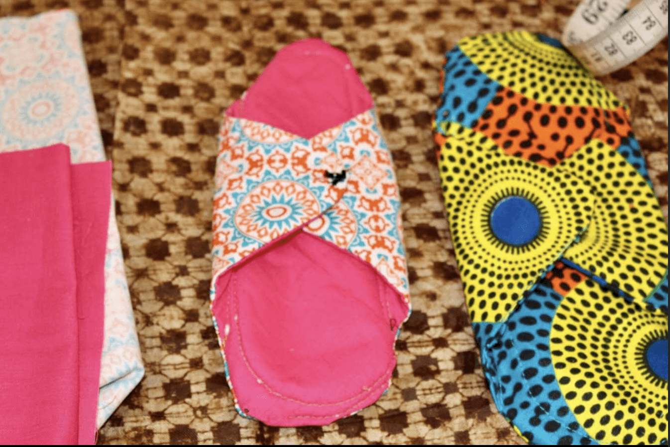 a cellphone leaning against a wall