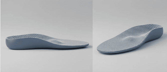 A close-up view of dark green leaves, creating a lush, textured background with subtle variations in color.